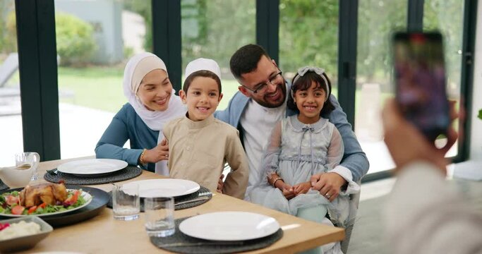 Islamic, photograph or happy family in home at lunch with smile or celebration of Eid or Ramadan in Dubai. Muslim child, people eating food or profile picture at dinner meal with parents, dad or mom
