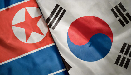 Flags of North and South Korea waving side by side, symbolizing the delicate balance between peace and conflict on the Korean Peninsula