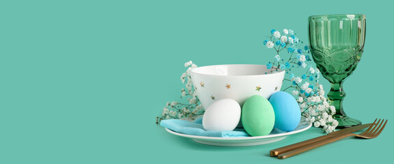 Beautiful festive table setting for Easter dinner on turquoise background with space for text