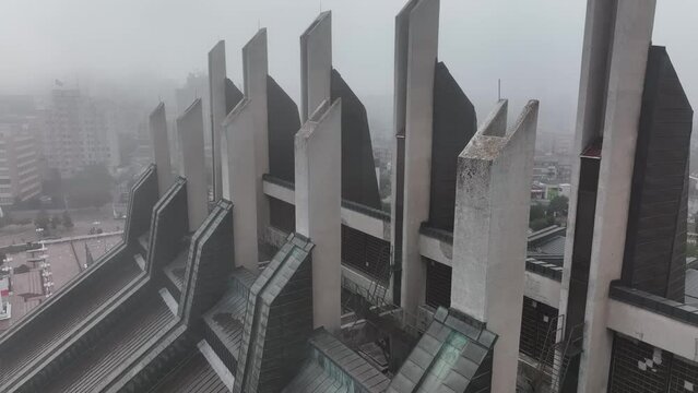 Aerial of Brutalist Modernist Sport Center in Pristina. Foggy morning in Prishtina, the capital of Kosovo, Europe.