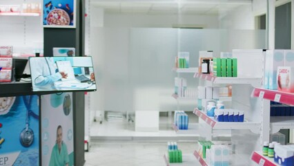 Medical pharmacy shelves stocked with healthcare goods and drugs, as well as packages including vitamins and antibiotics. Empty drugstore with medicine, painkillers and prescriptions.