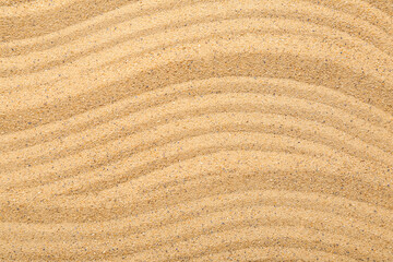 Fototapeta na wymiar Closeup view of sand texture with lines. Zen concept