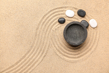 Fototapeta na wymiar Bowl and spa stones on sand with lines, closeup. Zen concept