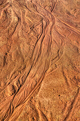 As the snow melts on the shore the water flows towards the lake and creates these riverlike patterns in the beach sand at Cole Park in Upstate NY.  Not a river delta but sand on a beach in Spring