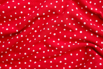 Closeup view of red polka dot fabric texture as background © Pixel-Shot
