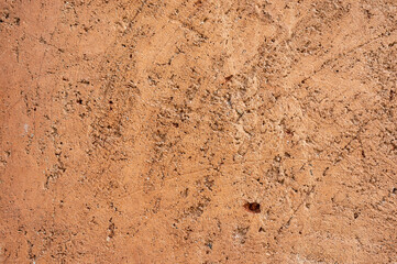 Full frame shot of an earthen wall texture of clay house structure.