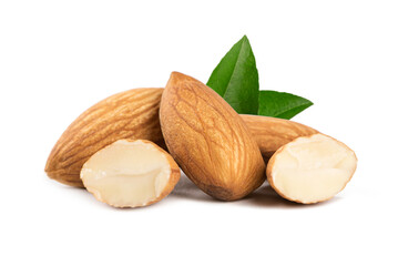 Almonds with green leaves on a white background.
