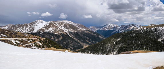 Independence Pass - A panoramic view at the summit of Independence Pass (12,095 ft), looking towards east, on a stormy Spring day. Colorado, USA.