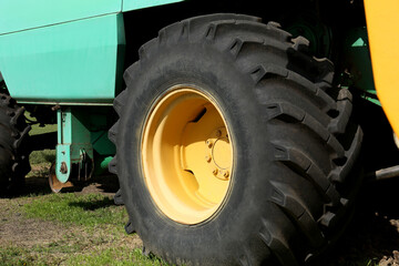 Modern combine harvester wheel outdoors, closeup view