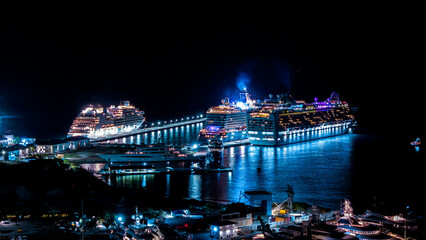 Beautiful scenic aerial night view cruise ships docked on the Caribbean island of St Maarten....