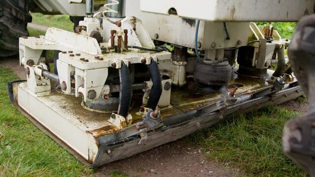 High Resolution Video of a Vibro-Truck. It shows a close-up of the plate, being laid out on the ground of a field path.