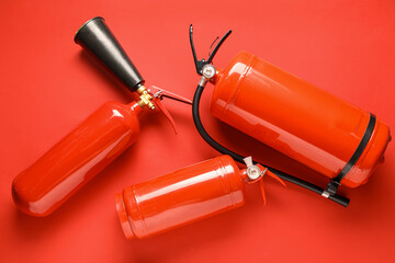 Fire extinguishers on red background