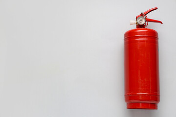 Fototapeta premium Fire extinguisher on grey background