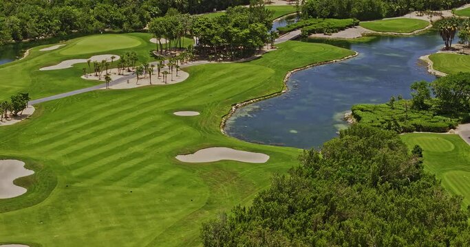 Akumal Mexico Aerial v17 zoom shot, drone flyover PGA Riviera Maya golf courses capturing beautiful landscape incorporating with Mayan jungle and natural lake - Shot with Mavic 3 Pro Cine - July 2023