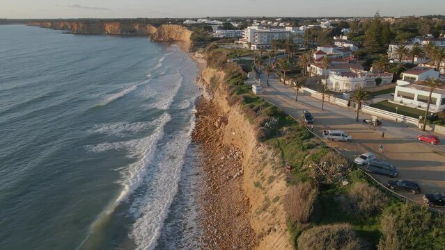 The drone image of the coastal city, the waves that hit the beach