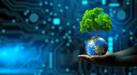 Man hand holding Tree on Earth with technological convergence blue background. Green computing, csr, IT ethics, Nature technology interaction, and Environmental friendly. Elements furnished by NASA.