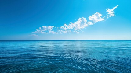 Obraz premium beautiful blue ocean in the middle of the sea with a beautiful blue sky, calm sea in high resolution and quality
