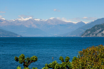 Mountain landscape, picturesque mountain lake in the summer morning, large panorama, landscape with fabulous lake view from the top of the mountain, with view of city. Como, Italy