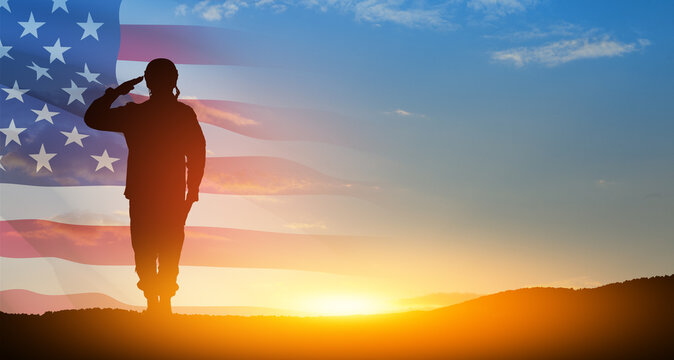 Silhouette of soldier saluting on background of USA flag. Greeting card for Veterans Day, Memorial Day.