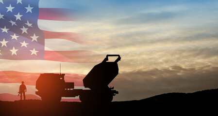 Artillery rocket system are aimed to the sky and soldier at sunset with USA flag. Multiple launch...