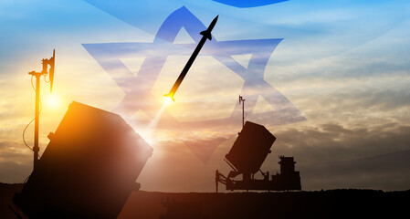 Closeup of Israel's Iron Dome air defense missile launches. Missiles are aimed at the sky at sunset...