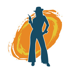 Silhouette of a slim female model wearing long pants and fedora hat in pose.