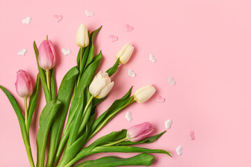 Beautiful tulips and hearts on pink background. International Women's Day