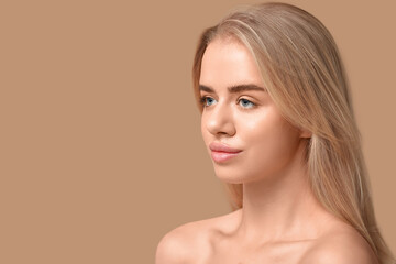 Young woman with beautiful lips on brown background