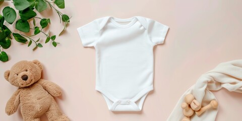 White cotton baby short sleeve bodysuit, teddy bear and natural wooden eco-friendly toys on pastel background. Infant onesie mockup. Blank gender neutral newborn bodysuit template mock up. Top view 
