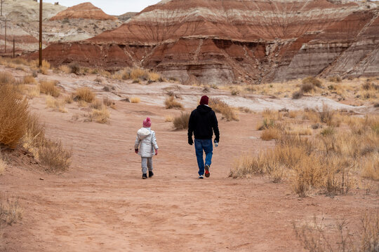 Dad and daughter hiking in the desert during the winter - Powered by Adobe