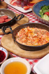 Turkish Menemen omelet in a frying pan. .