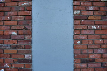 Red brick wall with concrete pillar.
