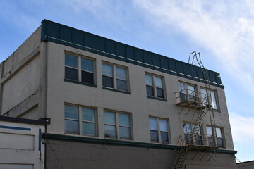 Fototapeta na wymiar Apartment building with fire escape.