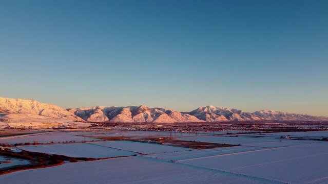 4k Aerial Drone Snow-Capped Mountains Overlooking Willard Bay, Utah