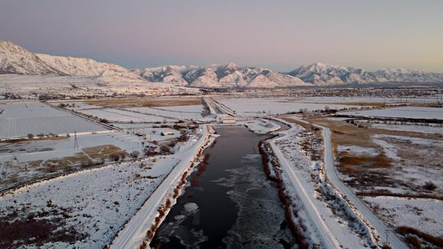 4k Aerial Drone Snow-Capped Mountains Overlooking Willard Bay, Utah