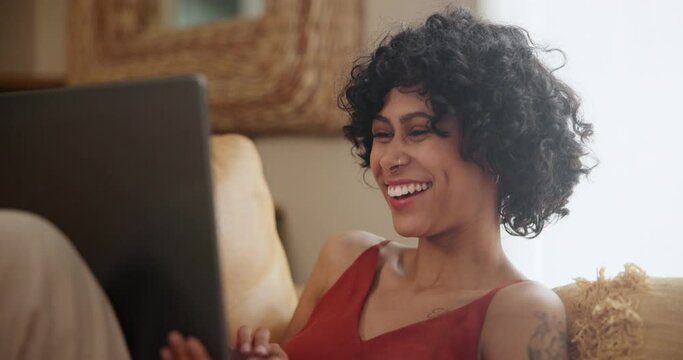 Relax, laptop and woman laughing on a sofa for movie day, film or streaming comic entertainment in her home. Pc, search and female person in a living room with online comedy, subscription or show