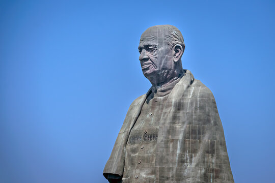 Close-up photo of Sardar Vallabhbhai Patel Statue of unity-World's tallest statue with clear blue sky background.