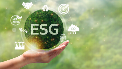 Hand of human holding green earth ESG icon for Environment Social and Governance, World sustainable...