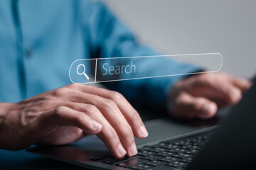 SEO search engine optimization concept, Businessman use laptop with virtual search bar. Marketing...