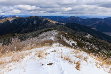 View from snow-covered mountain summit of beautiful winter landscape - 728965569
