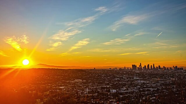 Time-lapse of sunrise behind the Los Angeles skyline from the westside of downtown