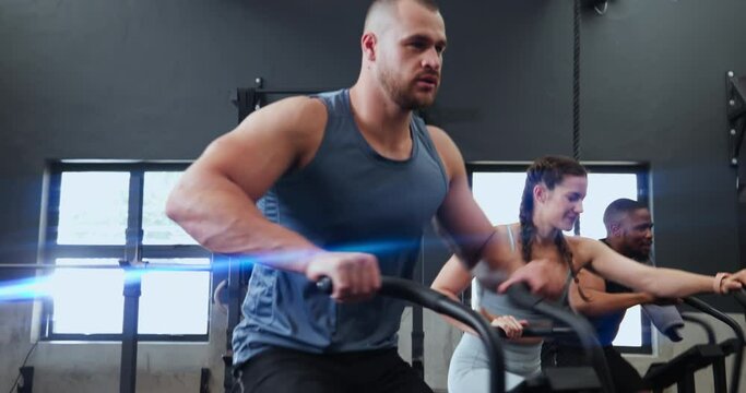 Fitness, spin class and man in gym for training, intense workout and exercise for health club. Sports, sweat and people on cycling equipment or machine for performance, endurance and cardio wellness