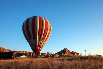 Hot air balloon against the blue cloudless sky
