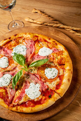 pizza with mozzarella on wooden background