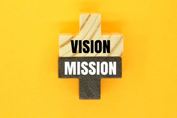 wooden puzzle with the words vision and mission