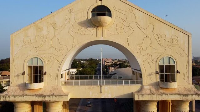 Beautiful aerial close-up ascending view of arch 22 monument building at entrance of Banjul city gateway, Gambia