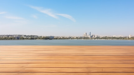 The empty wooden table top with a blurred background of the lake and the city