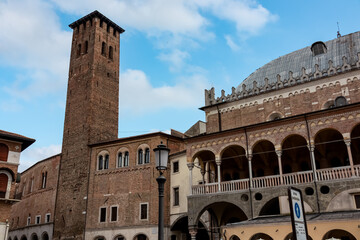 Fototapeta premium Scenic view from Piazza delle Erbe on the facade of Palazzo Della Ragione on sunny day in Padua, Veneto, Italy, Europe. Typical italian urban architecture with Venetian lion zodiacs and statues.