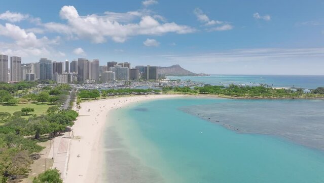 Ala Moana beach on sunny summer day. Aerial above Ala Moana Regional Park. People relaxing on amazing beautiful sunny day. Vacation trip for swimming and enjoying wonderful Hawaii island, Waikiki view