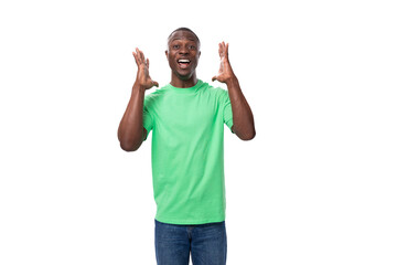 Fototapeta premium a handsome 30 year old african man dressed in a light green basic t-shirt has a strategy